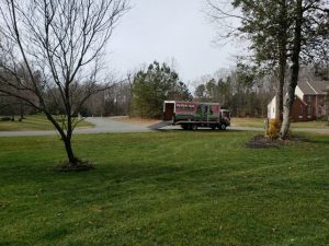 PPLM Pink Truck with Green Grass | DIY vs. Professional Lawn Care